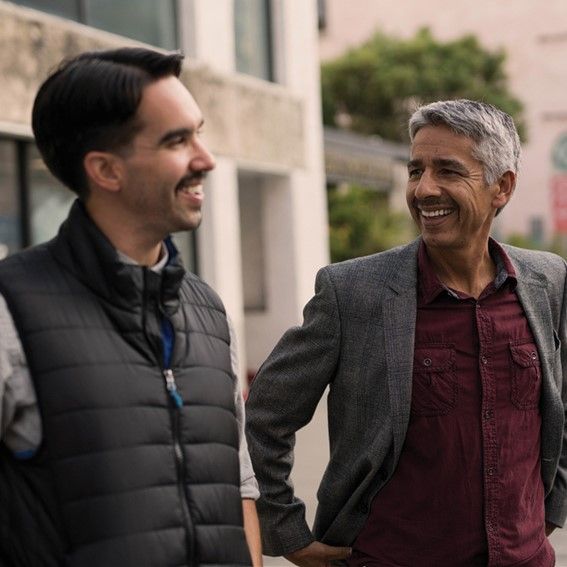 Two men in conversation.